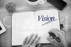 Vision  against man writing notes on diary