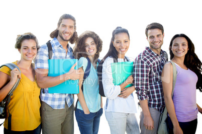 Composite image of smiling group of students standing in a row