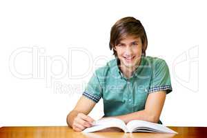 Student sitting in library reading