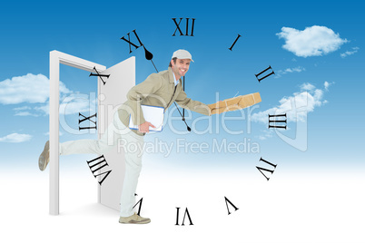 Composite image of happy delivery man running while holding parc