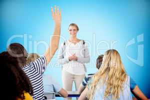 Composite image of student raising hand in classroom
