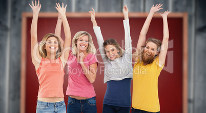 Composite image of smiling celebrating girls jumping up