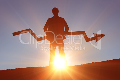 Composite image of businessman with arrow