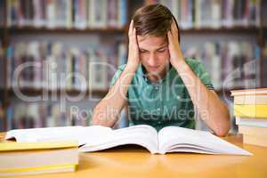 Composite image of student sitting in library reading