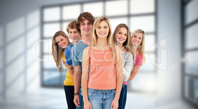 Composite image of full length shot of a smiling group standing