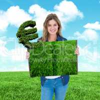 Composite image of woman holding lawn book