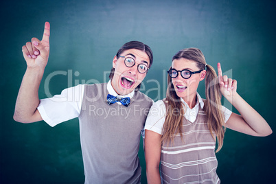 Composite image of geeky hipsters pointing