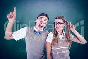 Composite image of geeky hipsters pointing