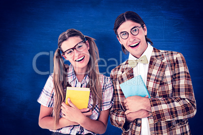 Composite image of geeky hipsters smiling at camera