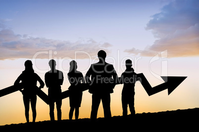 Composite image of business team with arrow