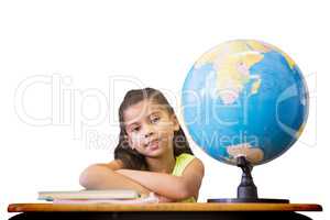 Composite image of cute pupils sitting at desk