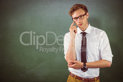 Composite image of young businessman thinking looking at camera