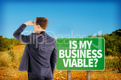 Composite image of wear view of businessman looking away