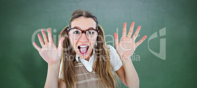 Composite image of female geeky hipster smiling at camera