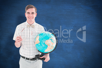 Composite image of geeky hipster holding a globe