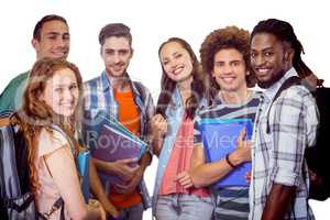 Composite image of smiling group of students holding folders