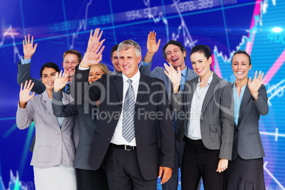 Composite image of smiling business team waving at camera