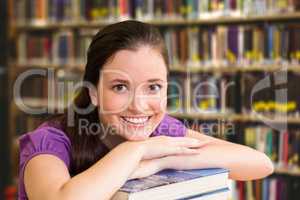 Composite image of portrait of female student in library