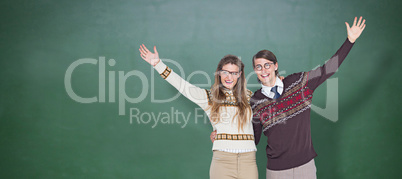 Composite image of happy geeky hipster couple embracing