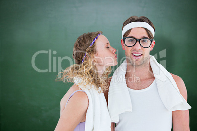 Composite image of geeky hipster kissing her boyfriend