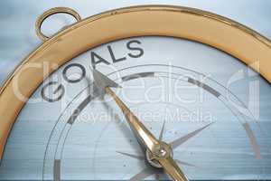 Composite image of compass pointing to goals