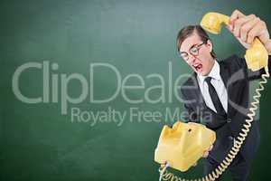 Composite image of geeky businessman shouting and hanging up the