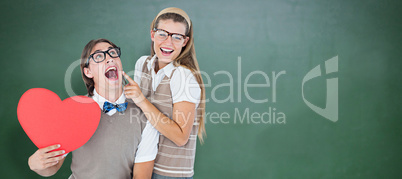 Composite image of excited geeky hipster and his girlfriend