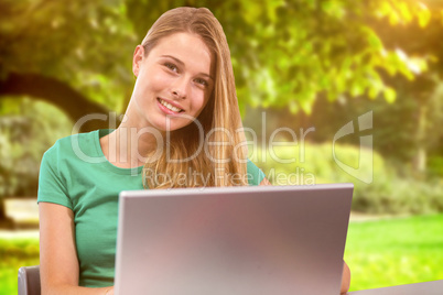 Composite image of student on laptop