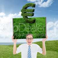 Composite image of man holding lawn book