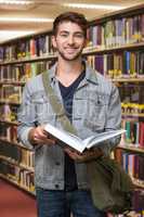 Composite image of student smiling at camera in library