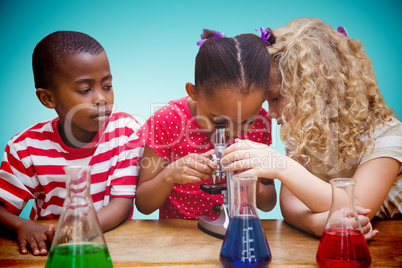 Composite image of cute pupil looking through microscope