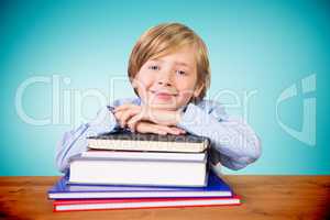 Composite image of cute pupil with books