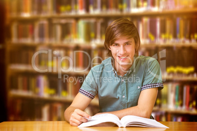 Composite image of student sitting in library reading