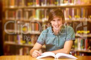 Composite image of student sitting in library reading