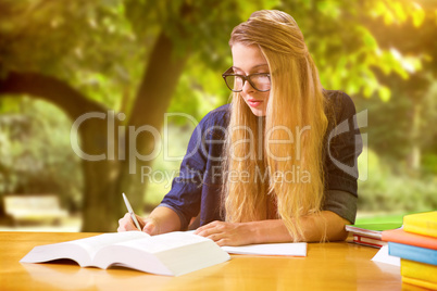 Composite image of student studying in the library