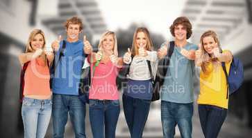 Composite image of smiling group giving a thumbs up as they wear