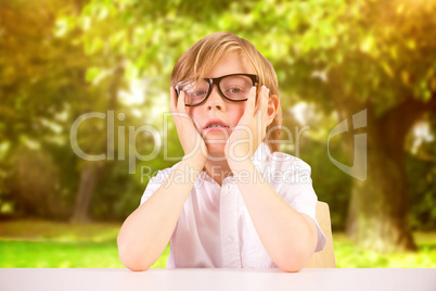 Composite image of cute pupil looking at camera