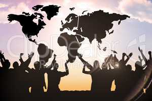 Composite image of silhouetters celebrating