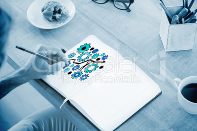 Composite image of man writing notes on diary