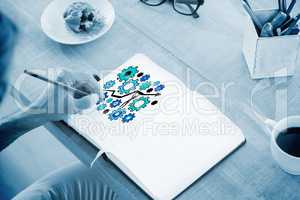 Composite image of man writing notes on diary