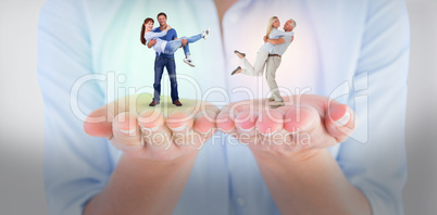 Composite image of man lifting up his girlfriend