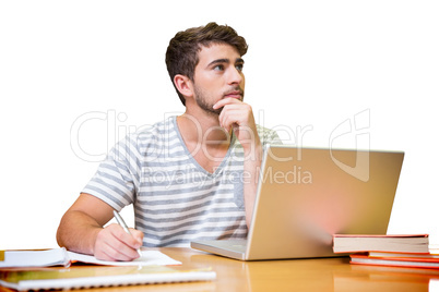 Student studying in the library with laptop
