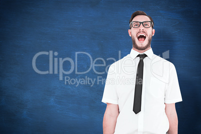 Composite image of geeky young businessman shouting loudly
