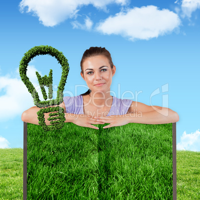 Composite image of woman with lawn book