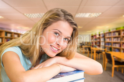 Composite image of portrait of female student in library