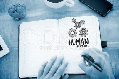 Composite image of man writing notes on diary