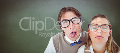 Composite image of funny geeky hipsters grimacing