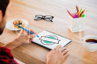 Composite image of creative businessman writing notes on noteboo