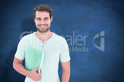 Composite image of student holding notepad