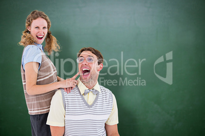 Composite image of excited geeky hipster couple Composite image of excited geeky hipster couple